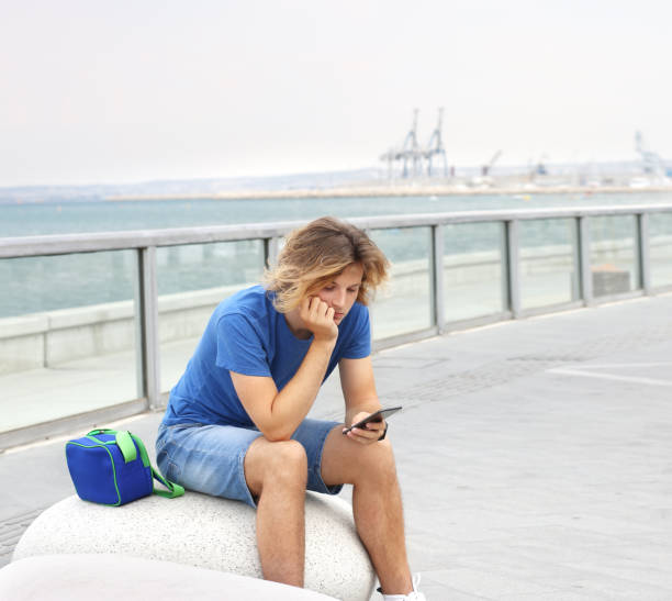 istock Teenage boy typing text message.Using smart phone. 1142056111
