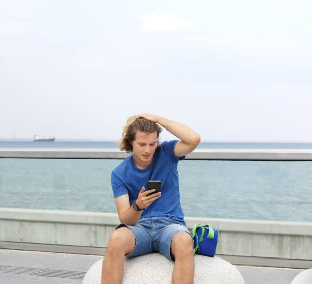 istock Teenage boy typing text message.Using smart phone. 1142056113