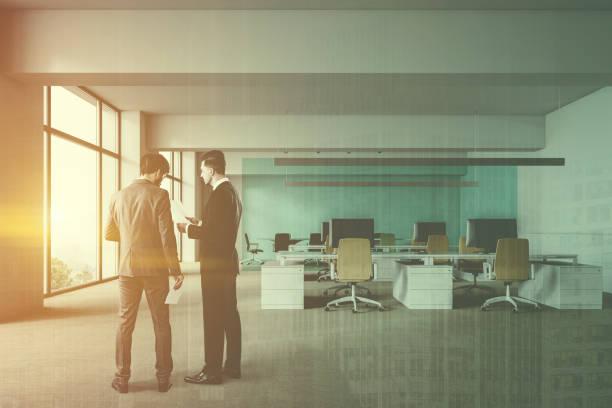 istock White and blue open space office, people 1142056546