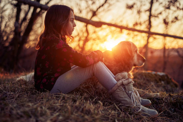 istock Two friends enjoying sunset / sunrise time in nature. 1142059071