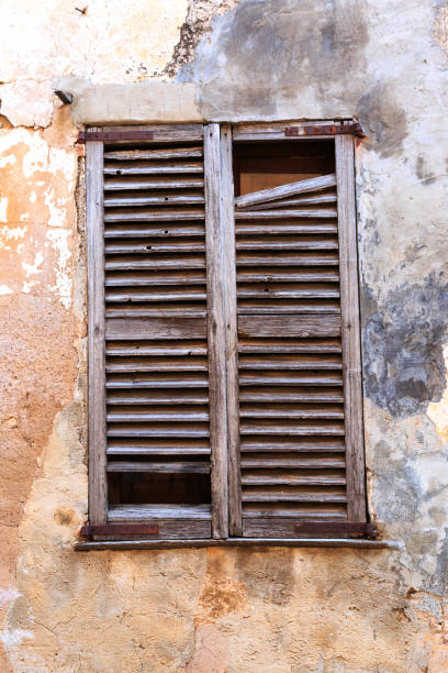 Europe, Spain, Balearic Islands, Mallorca. Wood shuttered window.