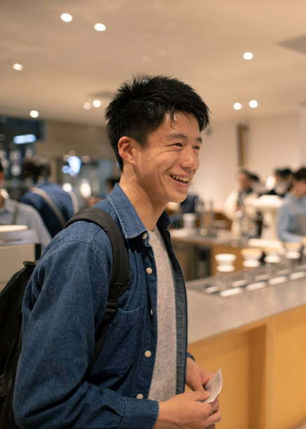 istock Teenage boy taking a coffee break at cafe 1142067686