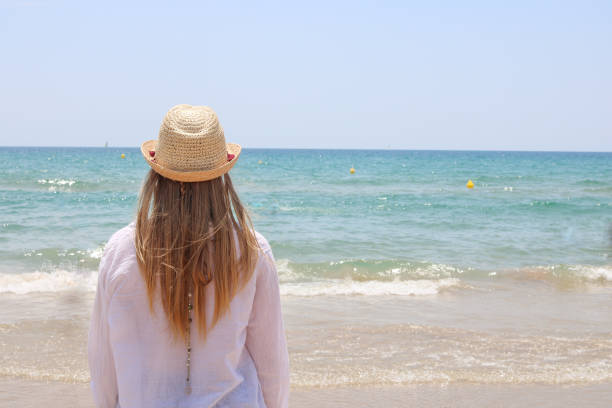 istock Pretty blonde woman observing the beach 1142070843