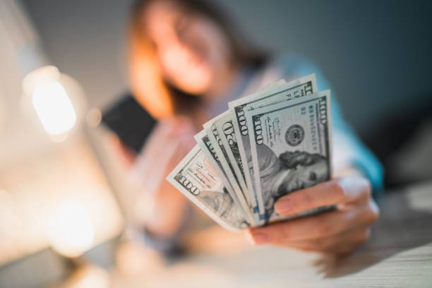 istock Female gambler celebrating victory 1142073647