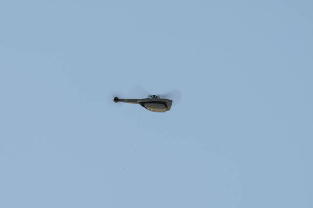 The Black Hornet Nano is a military micro unmanned aerial vehicle (UAV) developed by Prox Dynamics. This is a launch, flying and recovery demonstration for an aerospace industry briefing as part of the Unmanned Aerial Systems (UAS) Visits Day, Camp Kerr, Tin Can Bay Queensland.