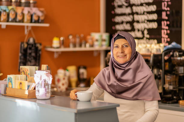istock barista at cafe counter in hijab 1142085076