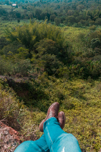 istock first person view of man´s feet on cliff edge 1142090723
