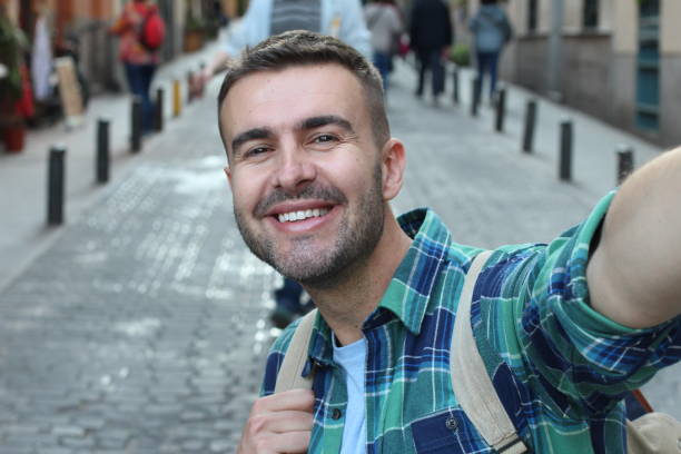 istock White man taking a selfie outdoors 1142094106