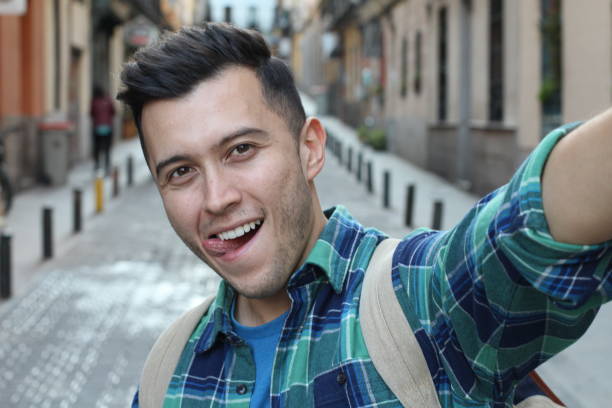 istock Guy taking a selfie outdoors to get likes on social media 1142094107