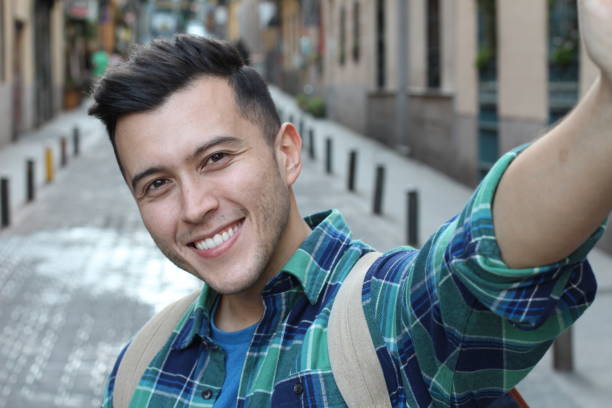 istock Very handsome ethnic man taking a selfie 1142094121