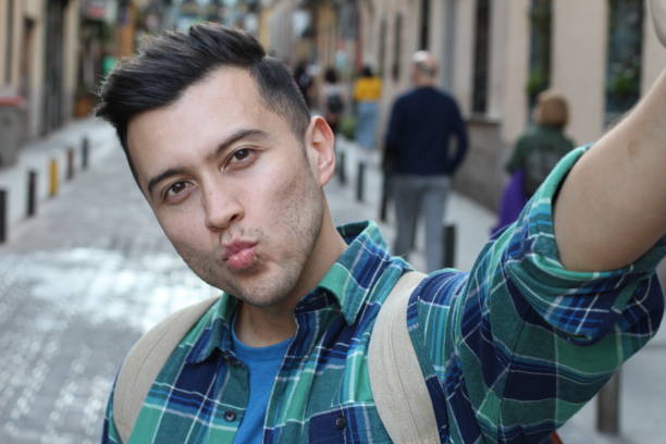 istock Ridiculous man posing with duck lips 1142094142