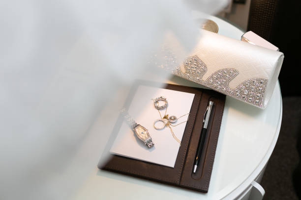 istock Womens wedding accessories and jewelry lying on a white table. 1142096906