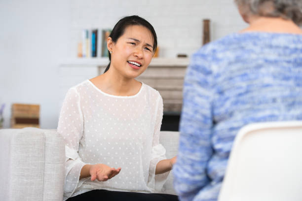 istock Woman speaking to therapist 1142099638