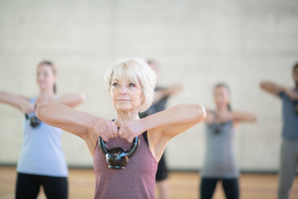 istock Senior woman with kettle bell 1142099733
