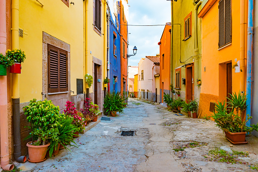 Beautiful narrow street in the picturesque Bosa old town, Italy. Colorful image of italian historic place.