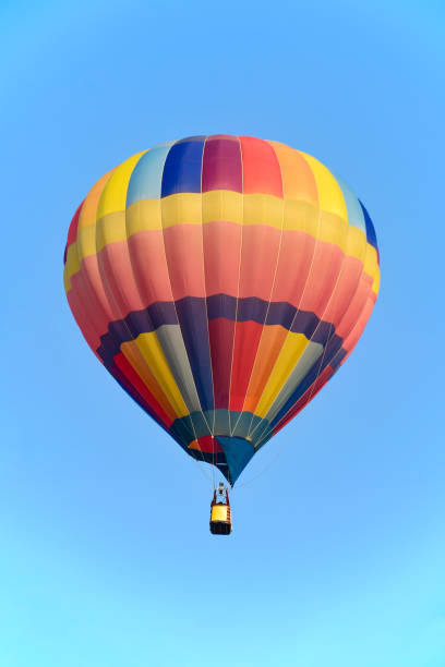 istock Colorful balloon over blue sky in the bright sun light. 1142103595