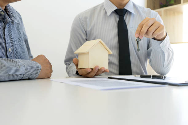 istock Young Business man insurance agent show document contract 1142103629