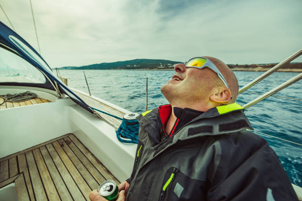 Yachting adventure man on the sailing boat