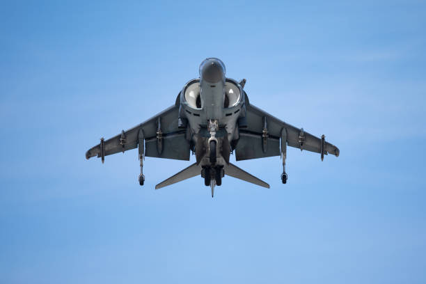istock Frontal and symmetric view of a AV-8B Harrier hovering against the sky 1142114822