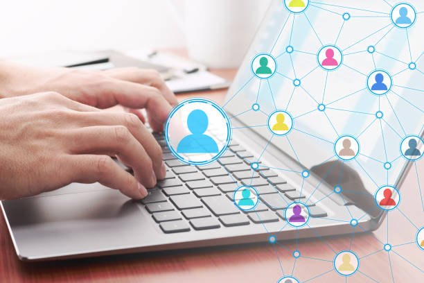 istock Online people network. Sending message by laptop. 1142115358