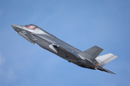 Side view of an F-35 Lightning II  right after at take off. with afterburner on