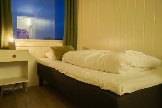 istock single bed in small bedroom in hostel for rest 1142115420