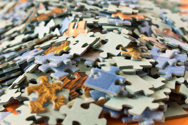istock Abstract background of many different puzzles. The concept of teamwork. Selective focus. 1142118642