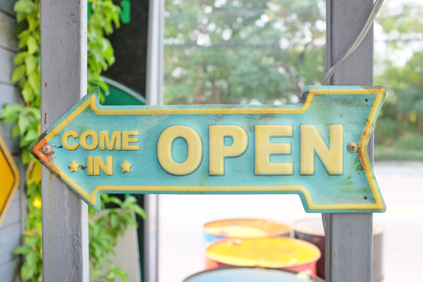 istock Arrow shape of open sign boardon pole, vintage style 1142122218