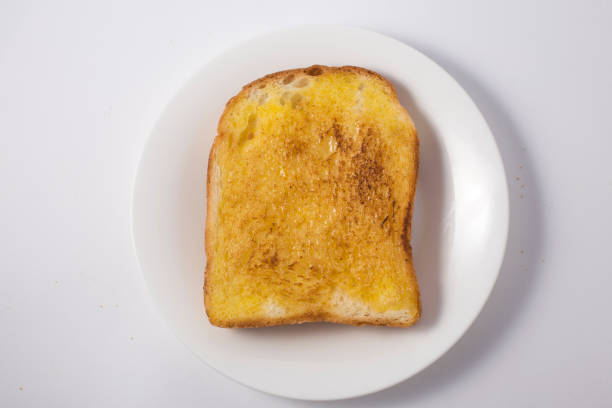 istock Slices of bread with butter 1142129824