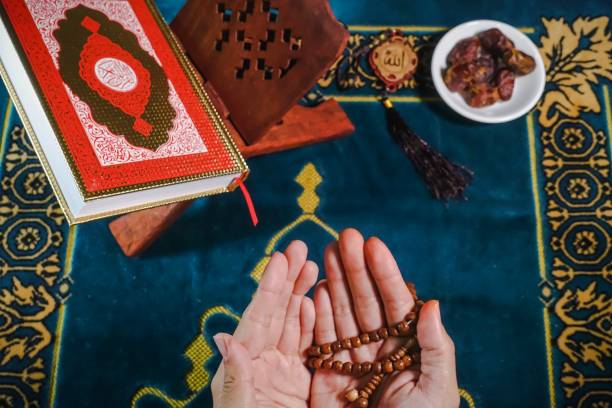 istock Islamic Concept: Qoran on sajadah (praying mat) 1142132545