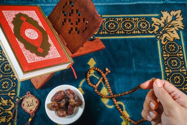 istock Islamic Concept: Qoran on sajadah (praying mat) 1142132570