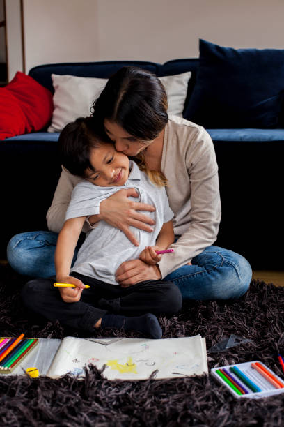 istock Mother and son do homework 1142136889