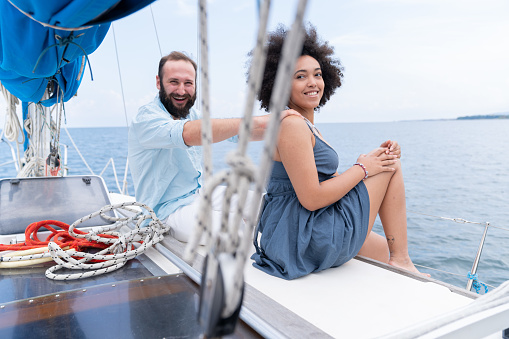 Couple yachting and enjoying summer vacations.