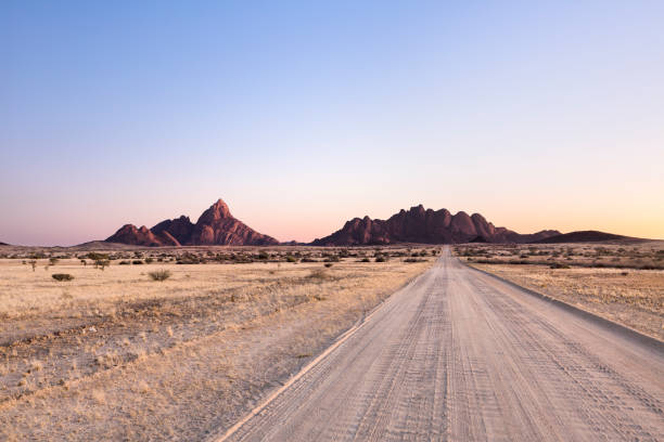 istock A road leading towards the Spitzkoppe and the Pondoks, Namibia. 1142139035