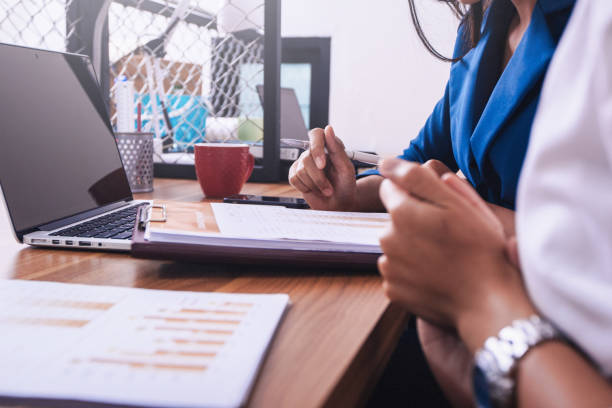 istock Discussing plan and idea to improvement strategy, businessmen brainstorming for strategy of business investment,businessmen review chart and document of investment information 1142142743