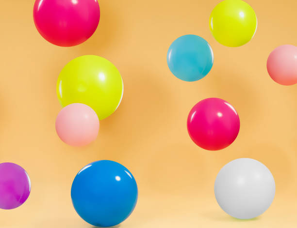 istock Colorful balloons with orange background 1142144523
