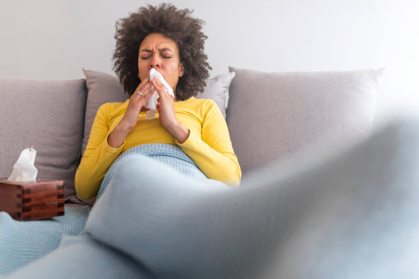 istock Ill young black woman with cold, lying in bed 1142146221