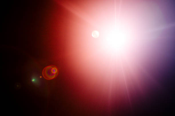 istock Abstract Natural Sun flare or Far star on the black background 1142147571