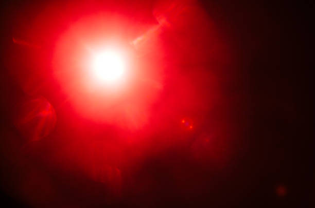 istock Abstract Natural Sun flare or Far star on the black background 1142147812
