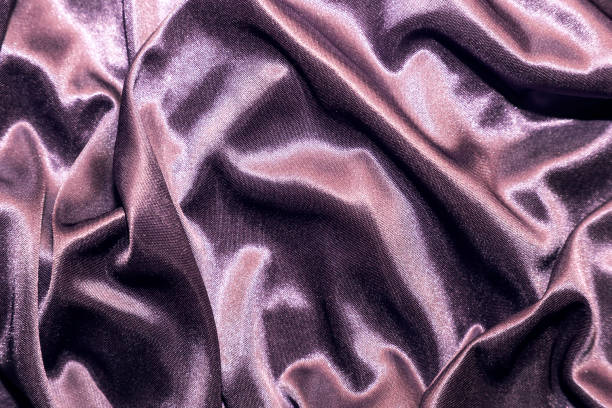 istock Abstract elegant silk satin purple violet background with highlights with soft fabric texture 1142147826