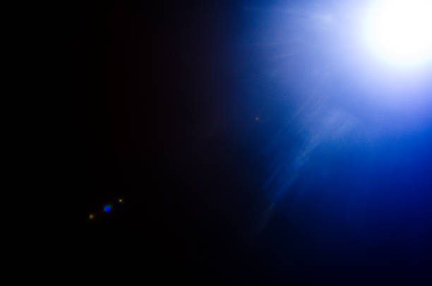 istock Abstract Natural Sun flare or Far star on the black background 1142147835