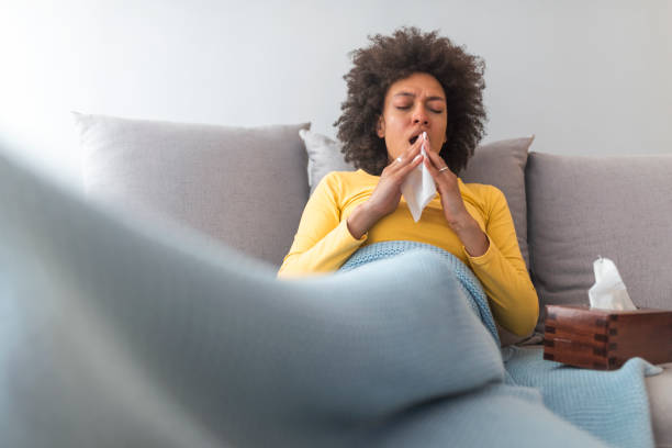 istock Ill young black woman with cold, lying in bed 1142148681