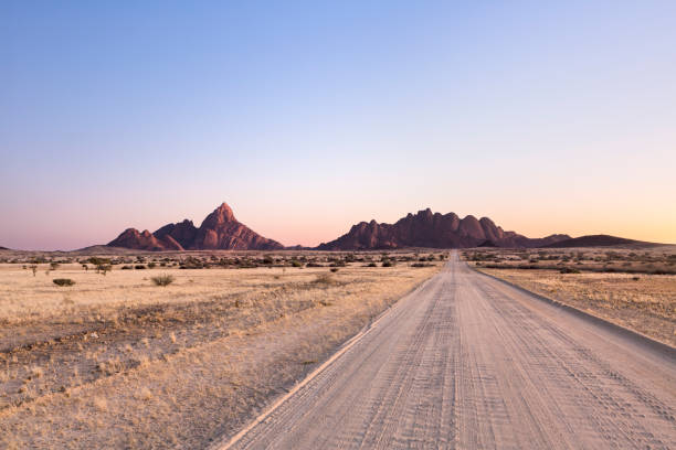 istock A road leading towards the Spitzkoppe and the Pondoks, Namibia. 1142148725