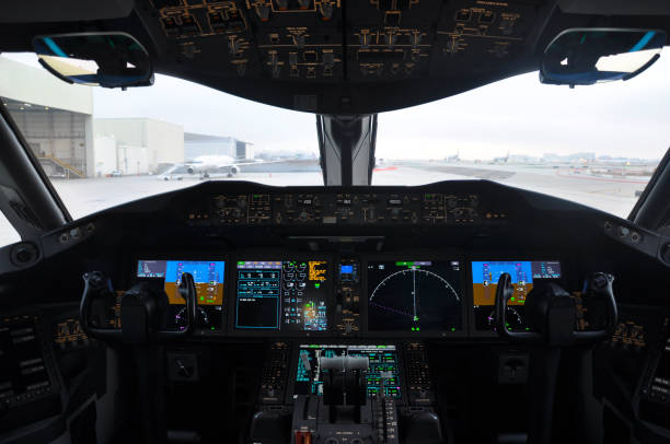 Empty flight deck of a 787 dreamliner in daytime. Cockpit. Empty flight deck of a 787 dreamliner in daytime. Cockpit. cockpit stock pictures, royalty-free photos & images