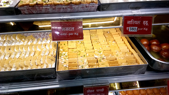 Indian desserts sweets shop with price list at little indian town