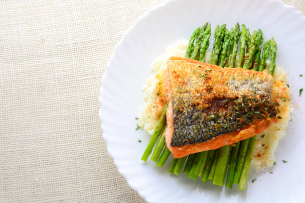 istock Grilled salmon garnished with asparagus and herbs 1142155387