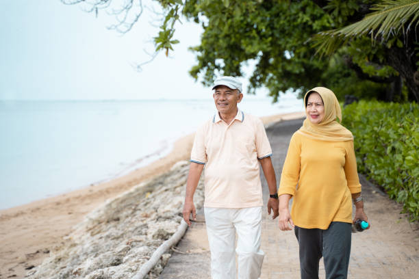 istock senior asian couple walking and exercising 1142155718