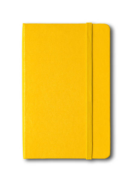 Yellow closed notebook isolated on white Yellow closed notebook mockup isolated on white moleskin stock pictures, royalty-free photos & images