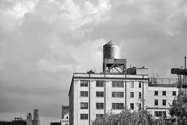 istock Water tower on a building rooftop, New York. 1142165772