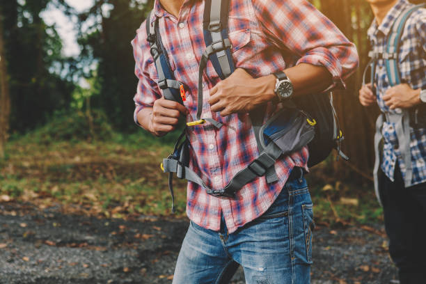 istock Hiking man traveling with backpack in mountains 1142166105